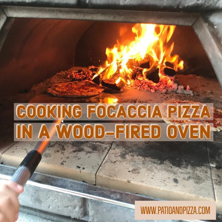 Cooking a Focaccia Pizza in Wood Burning Oven