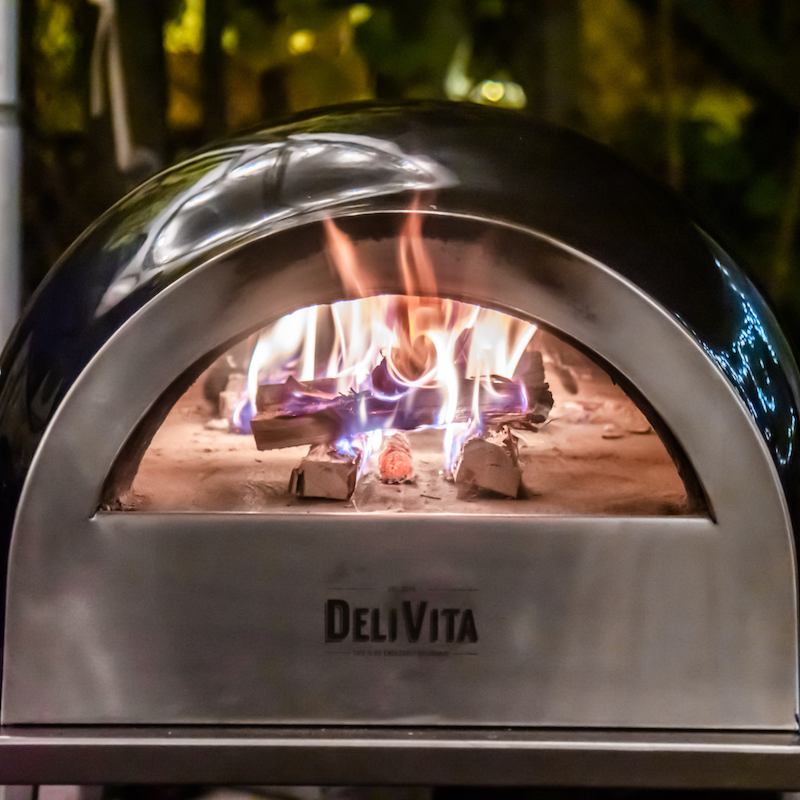 Fire burning in a DeliVita wood pizza oven