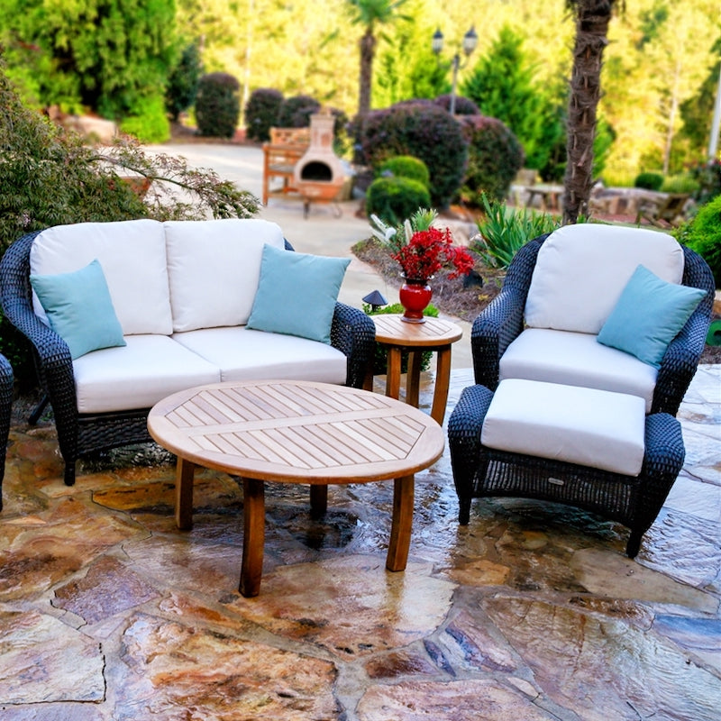 Tortuga outdoor furniture with blue chairs, white cushions, and teak table