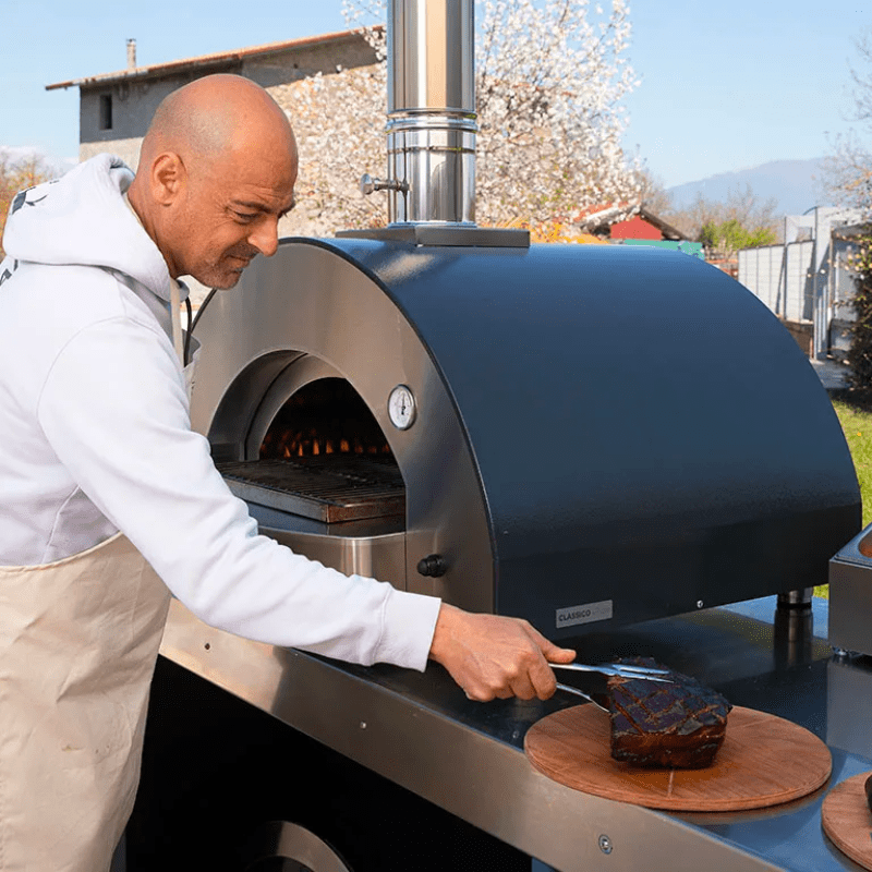 Man Cooking Meat Using An Alfa Oven with the Slow and Low Kit