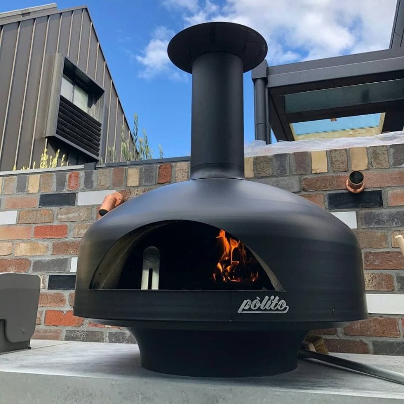 Black Polito Giotto Wood Fired Oven With Bench Stand with live fire and thermometer inside