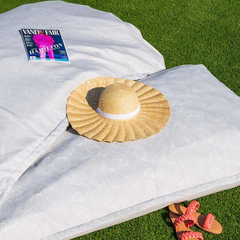 Ledge Laze Pillow in Pearly Swirls on the grass