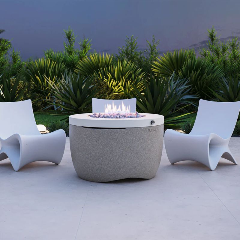 Ledge Halo outdoor Fire pit and Autograph Chair in a modern backyard patio