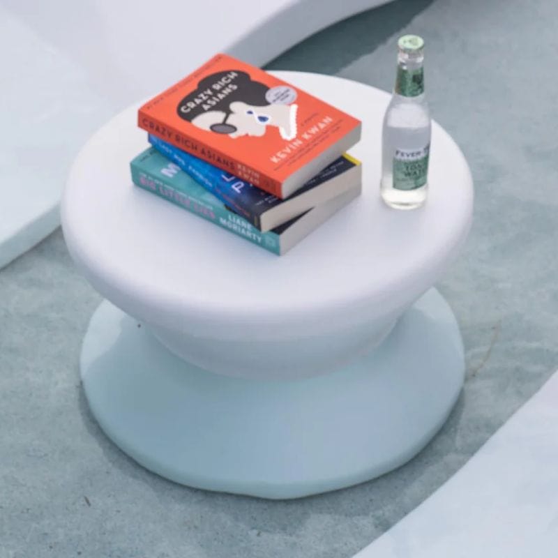 White Ledge Signature Standard Side Table with a stack of books and a bottle of water