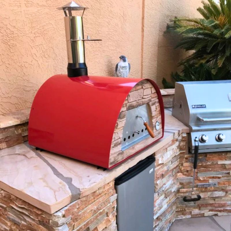 Outdoor Kitchen with the Maximus Arena oven next to a grill