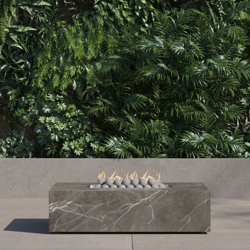 OuterStone rectangular fire pit table with ceramic stone spheres with fire burning