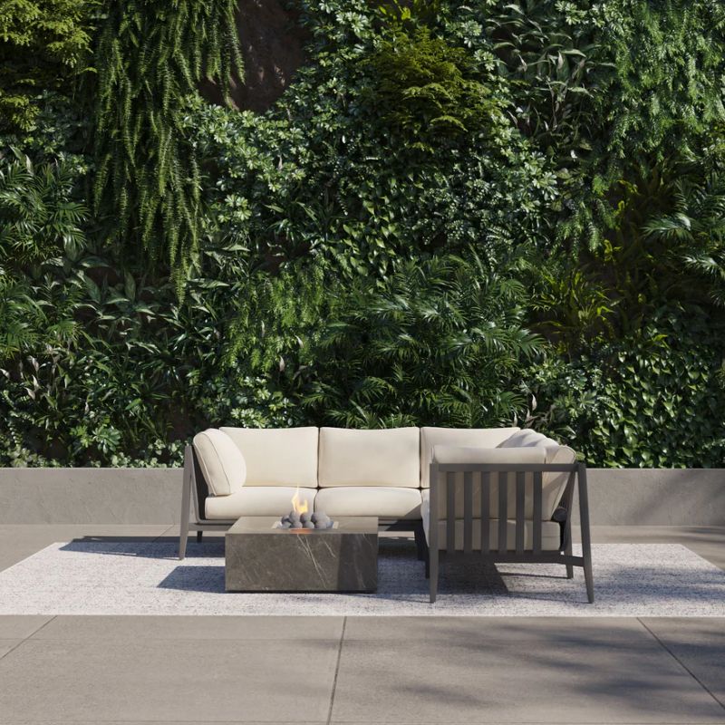 OutderStone Fire Pit Square table in outdoor lounge with greenery