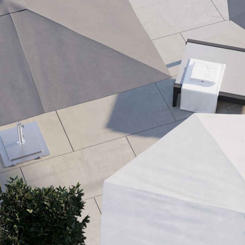 Gray OUTER Square Umbrella next to the White OUTER Round Umbrella