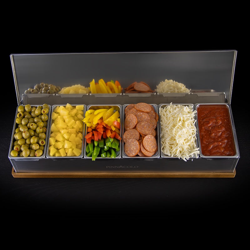 Olives, pineapple chunks, peppers, pepperoni, shredded cheese, and pizza sauce in the Pinnacolo 6-Compartment Topping Carrier