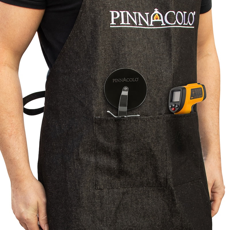 Pizza Cutter and Infrared Thermomter in the pockets of the Pinnacolo Denim Apron