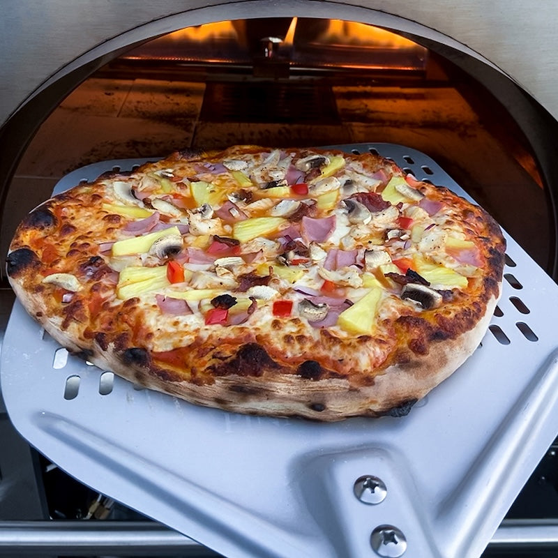 Hawaiian Pizza taken out of the oven