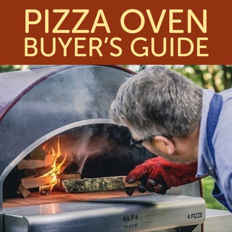 Man putting wood into his outdoor pizza oven