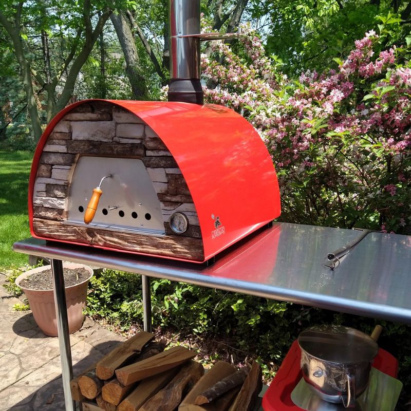 Red Maximus Arena Oven on a Stainless steel table