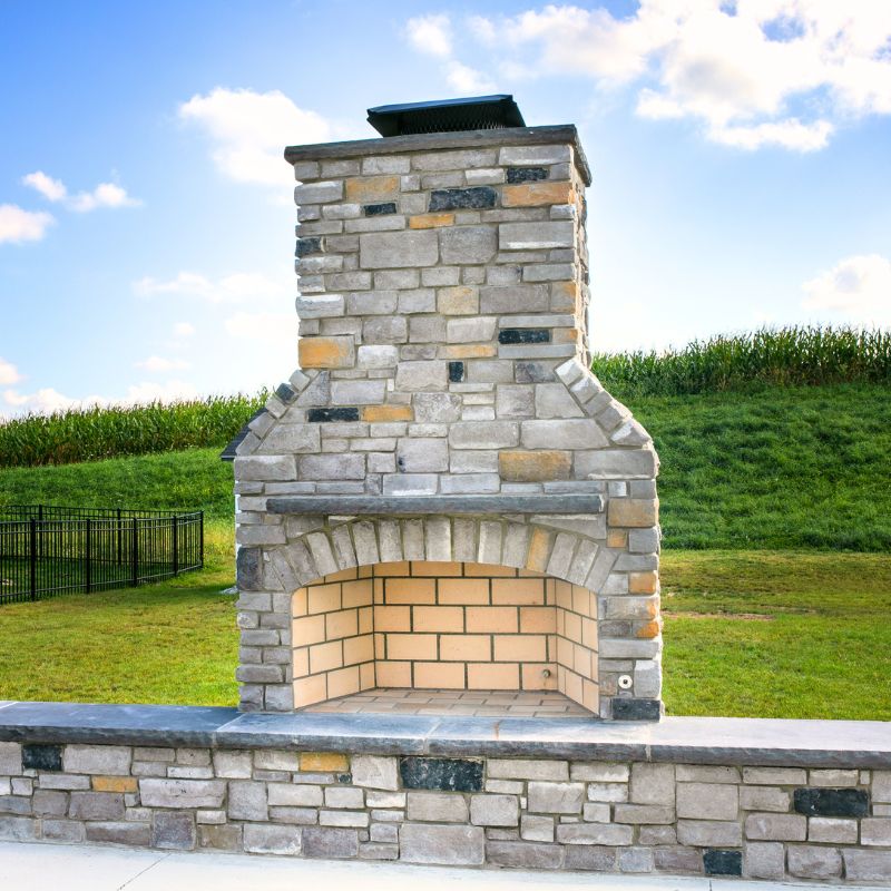 Round Grove outdoor fireplace with large arched firebox opening