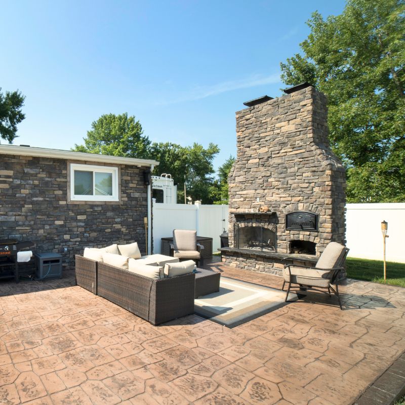 Round Grove Brick Oven installed next to a fireplace