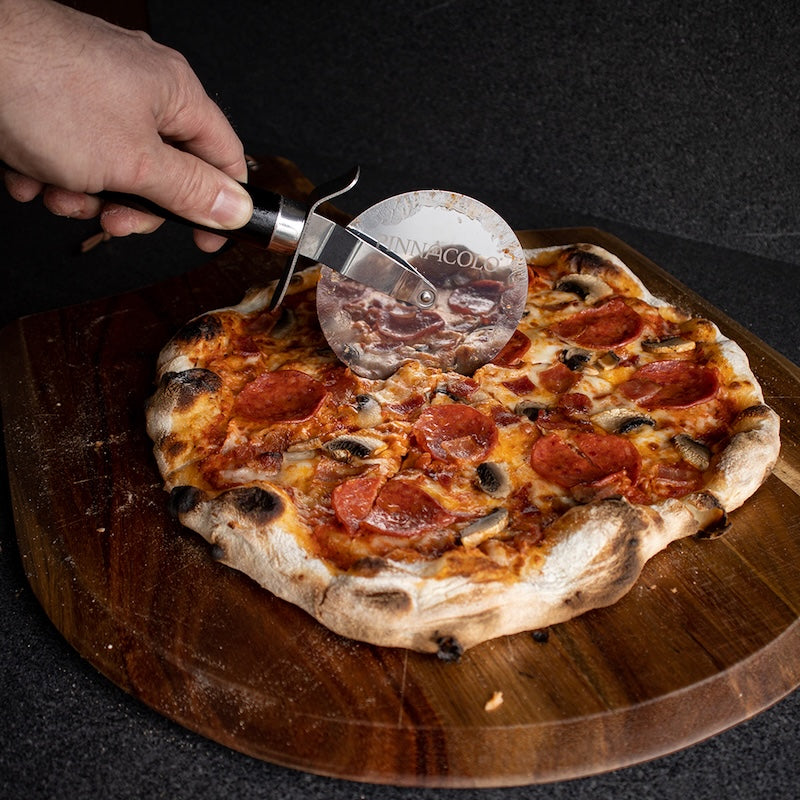 Slicing a pepperoni pizza with the Pinnacolo Wheel Cutter