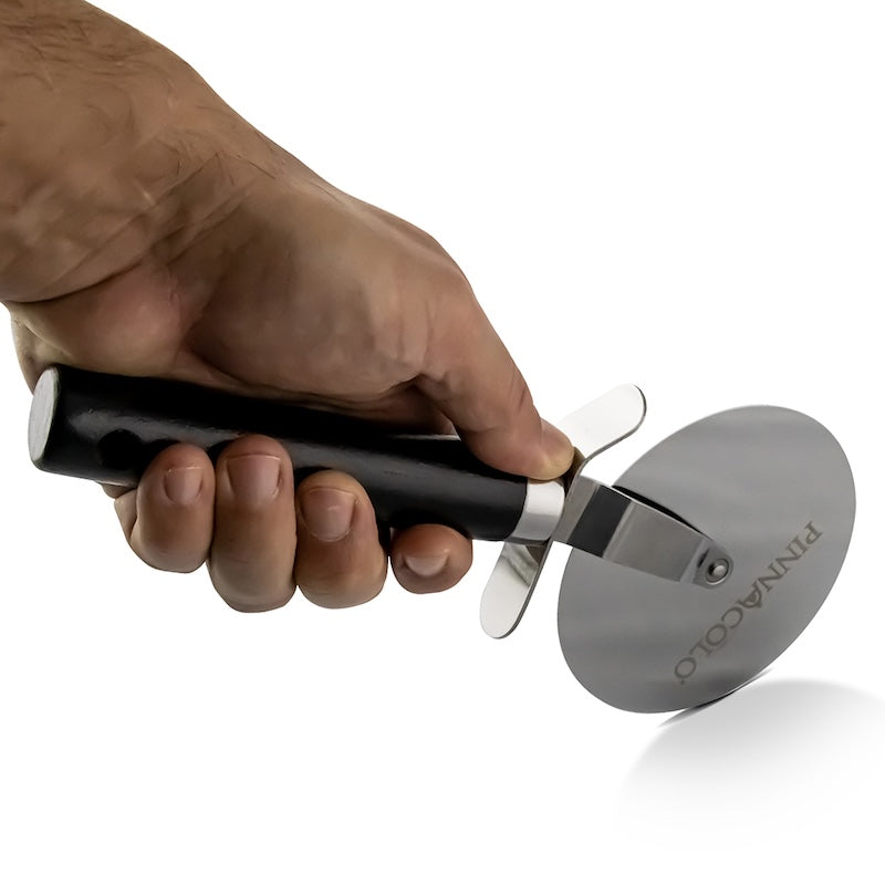 a hand holding the Pinnacolo 4&quot; Wheeled Pizza Cutter with Wooden Handle
