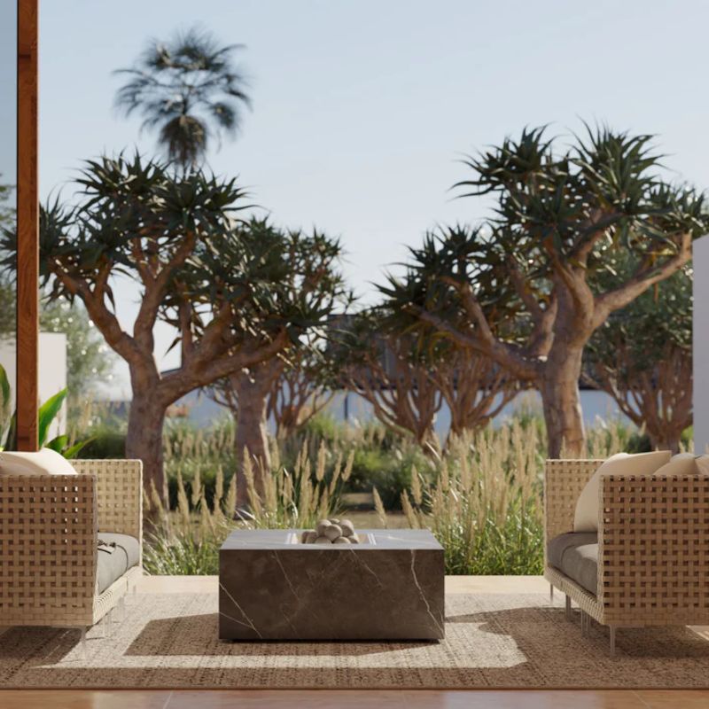 OuterStone Fire Pit Table in between two 3 Seater Open Weave Wicker Sofa in a patio