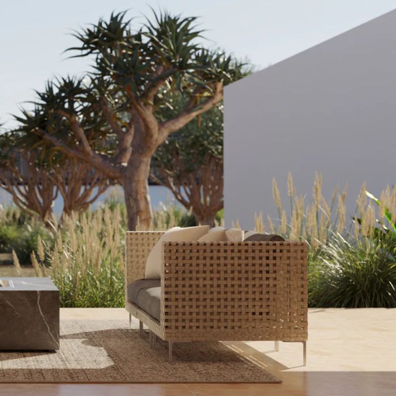 3 Seater Handwoven All Weather Wicker overlooking the backyard