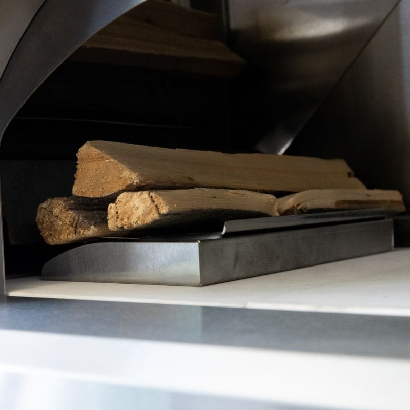 Cooking Wood on top of the wood holder inside the Summerset Hybrid Oven