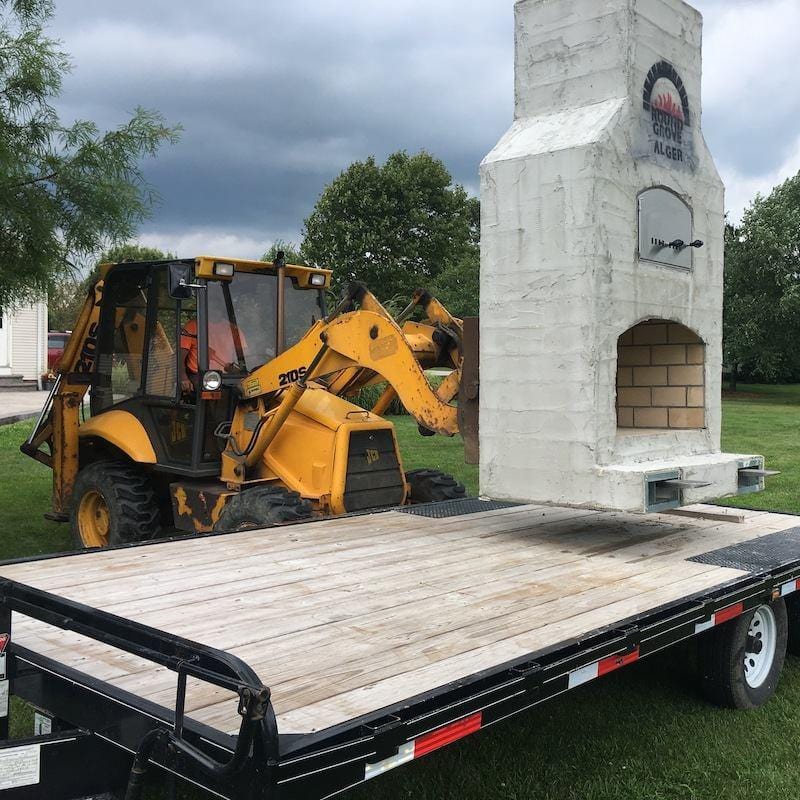 Unloading Round Grove Fireplace with Pizza Oven