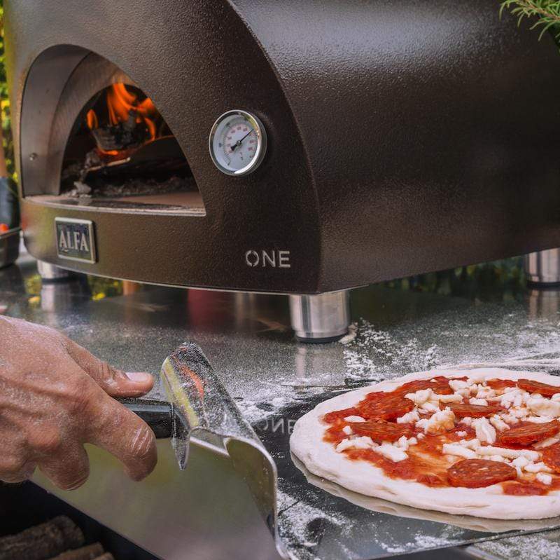 Portable pizza oven Alfa ONE cooking outdoors