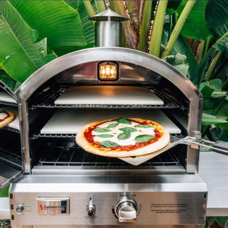 Baking a pizza in the Summerset Countertop Gas Pizza Oven
