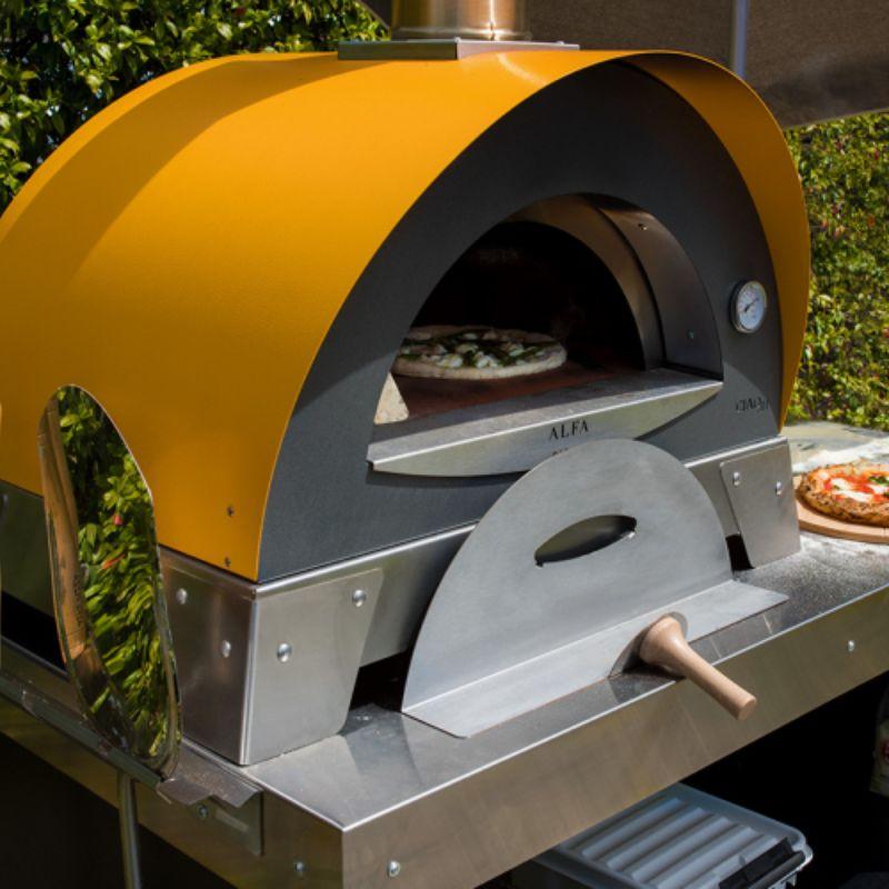 Cooking pizza in a Wood Fired Oven by Alfa Ciao 