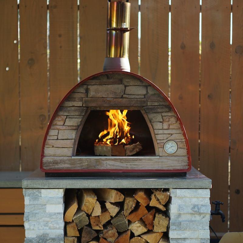 Cooking in the Maximus Arena Outdoor wood pizza oven